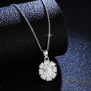 S925 sterling silver necklace featuring oval halo moissanite pendant on black stand