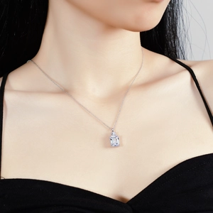 S925 sterling silver necklace featuring emerald cut moissanite on a female model