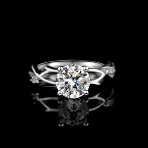 Moissanite ring with round solitaire on woven 925 silver band with mirror reflection