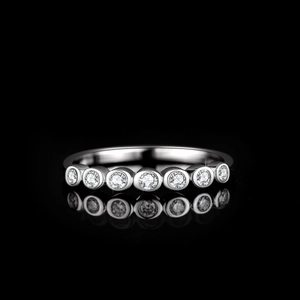 Polished 925 sterling silver ring with seven round-cut moissanite stones in bezel setting