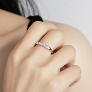 Elegant 925 sterling silver ring with sparkling moissanite stones on a female hand