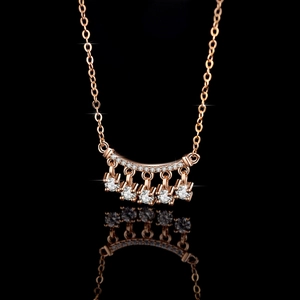 Elegant rose gold S925 silver necklace featuring a moissanite bell tassel pendant on black