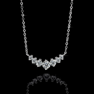 S925 sterling silver V-shaped necklace with gradient moissanite stones on black background