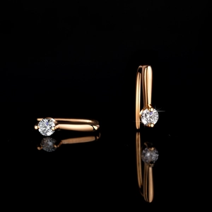 Elegant S925 silver earrings with sparkling moissanite stones on black reflective surface