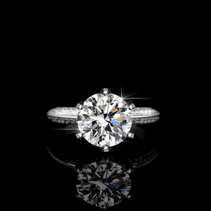 Luxury S925 sterling silver moissanite ring with six-prong setting on black mirror surface