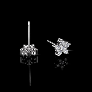 S925 silver flower stud earrings with sparkling moissanite stones on black background