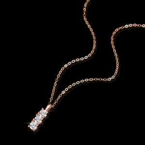 Elegant rose gold S925 silver necklace with three vertical moissanite stones on black background