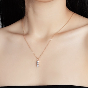 S925 silver necklace with three vertical moissanite stones in a rose gold finish
