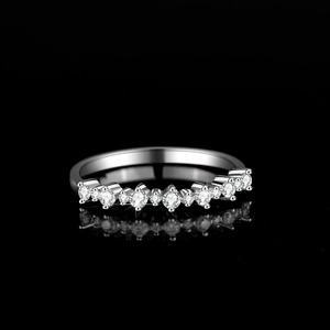 Sparkling S925 sterling silver moissanite multi-stone row ring on black mirror reflection