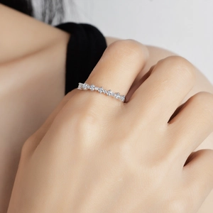 Elegant 925 sterling silver moissanite row ring worn by model for luxury jewelry display