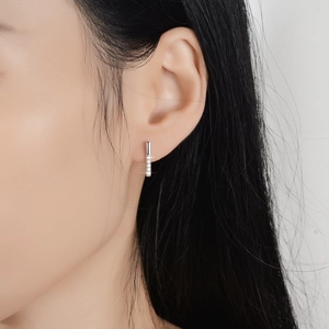 S925 sterling silver rectangle baguette stud earrings with sparkling moissanite on model