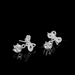 S925 silver bow stud earrings featuring sparkling round stones and elegant tassel design