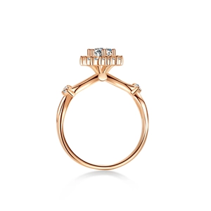 Bague classique en or rose 18K avec moissanite ronde et pierres latérales scintillantes