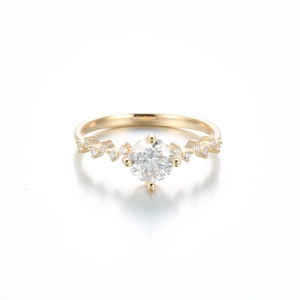 Elegant six-prong moissanite crown ring in champagne gold finish on white background