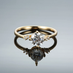 Classic six-prong moissanite ring in champagne gold finish with brilliant side accents