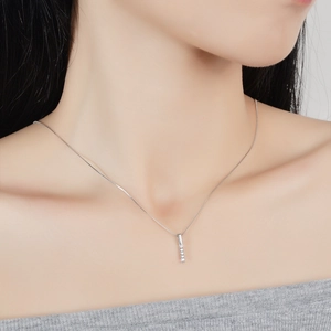 Elegant s925 silver necklace with sparkling moissanite gems worn by a model