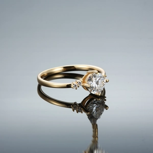 Six-prong crown moissanite ring in champagne gold finish with brilliant center stone