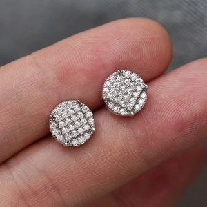 Macro shot of silver S925 moissanite stud earrings featuring cluster geometric stones