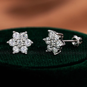 Macro view of 925 silver flower stud earrings with D-color moissanite and screw-backs