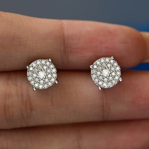Macro shot of S925 sterling silver moissanite stud earrings featuring pavé setting stones