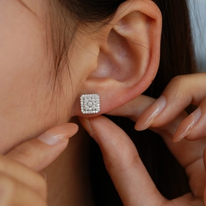 Elegant 925 sterling silver square moissanite stud earrings shown on model ear