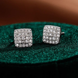 Detailed macro view of square S925 sterling silver stud earrings with moissanite pavé setting