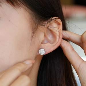 Elegant s925 silver round moissanite pave stud earrings on model for a sophisticated look