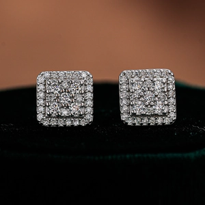 Macro shot of 925 sterling silver square cluster stud earrings with moissanite diamonds