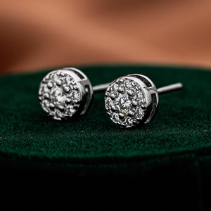 Macro shot of 925 silver moissanite halo stud earrings with secure screw backs