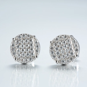 Macro shot of S925 silver round stud earrings featuring micro-pave moissanite stones