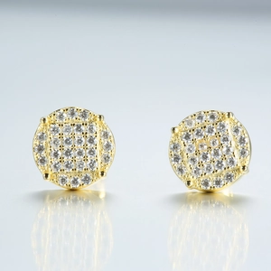 Detailed view of round S925 silver moissanite earrings with gold plating and paved stones