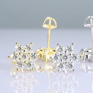 Close-up of 925 silver moissanite flower stud earrings with secure screw backs