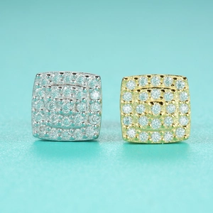Detailed close-up of square Moissanite stud earrings in silver and gold pavé setting