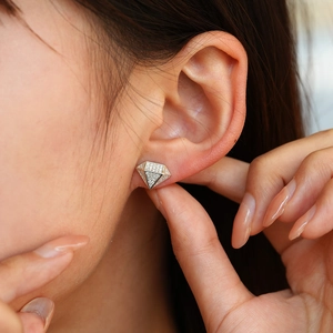 Moissanite S925 silver stud earrings with a diamond-shaped full pavé design on ear