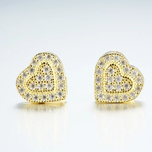Detailed view of gold-plated 925 sterling silver heart studs with micro-pave moissanite