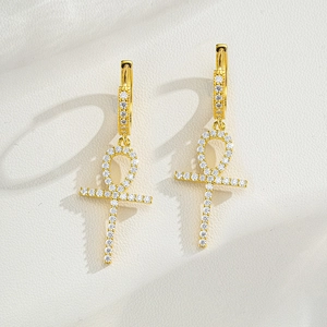 Macro view of gold S925 sterling silver Ankh cross earrings with micro-inlaid stones