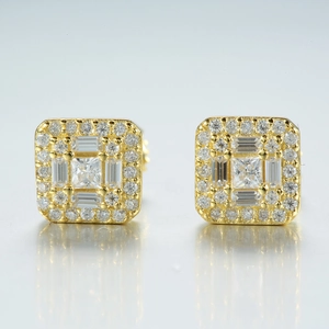 Macro shot of S925 sterling silver square moissanite earrings with gold plating details
