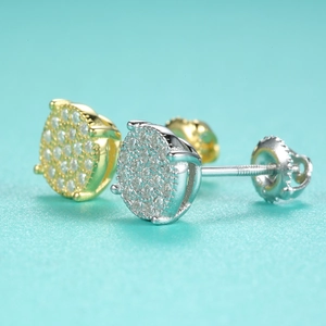 Macro view of gold and silver S925 sterling silver moissanite stud earrings with screw backs