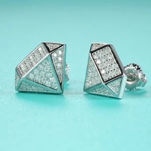 Macro shot of silver S925 geometric diamond earrings with Moissanite stones and screw backs