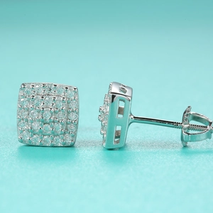 Macro shot of square moissanite stud earrings featuring secure screw-back closures