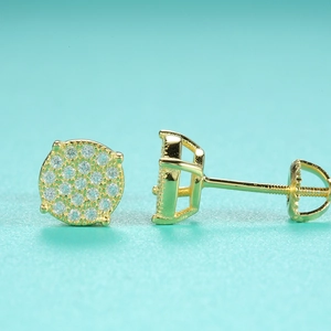 Macro shot of gold moissanite stud earrings featuring secure screw-back posts and sparkling stones