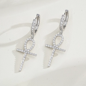 Macro detail of S925 sterling silver Ankh cross earrings with full moissanite inlay