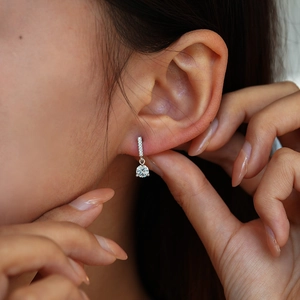 S925 sterling silver moissanite drop earrings with sparkling round tassel pendant on model