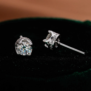 Macro shot of S925 silver moissanite stud earrings with a six-prong crown setting