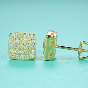 Macro view of gold-plated square moissanite stud earrings with secure screw-back posts