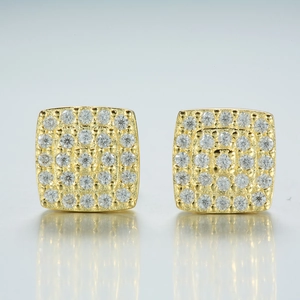 Detailed close-up of square gold-plated moissanite stud earrings with pavé set stones