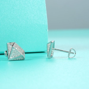 Macro shot of S925 sterling silver diamond-shaped stud earrings with micro-pave stones