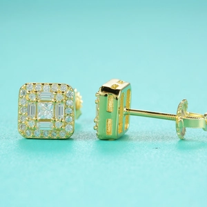 Detailed macro of golden square halo moissanite earrings with screw back design