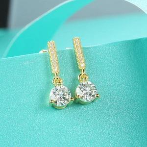 Macro detail of S925 sterling silver moissanite stud earrings with classic fringe drop