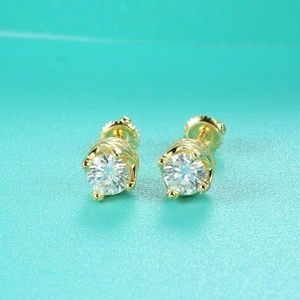 Macro view of S925 silver moissanite earrings with gold crown setting and screw back